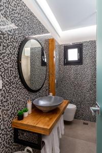 a bathroom with a sink and a mirror at LevandaMykonos in Mýkonos City