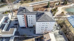 an overhead view of a large white building at City Apartment Sairaalakatu in Kuopio