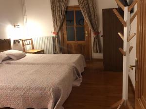 a bedroom with a bed and an open door at Casa Ferreiro in Seoane