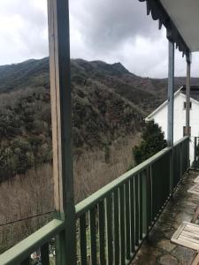 a view from the porch of a house with the mountains in the background at Casa Ferreiro in Seoane