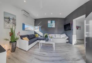 Telewizja i/lub zestaw kina domowego w obiekcie villa flores