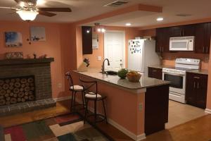 a kitchen with an island with a stove and a refrigerator at Cozy retreat in sunny Florida in Sarasota