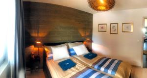 Ένα ή περισσότερα κρεβάτια σε δωμάτιο στο Appart 4 pers. Ski In & Out
