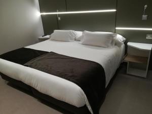 Cama o camas de una habitación en Hotel & Spa Ciudad de Binéfar