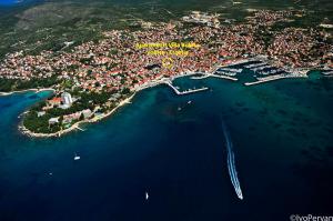 an aerial view of a small island in the water at Sunny Bobica Apartments in Vodice