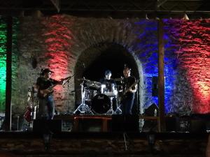 a group of people playing drums on a stage at Apartman Ema in Špania Dolina