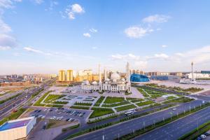 a view of a building in a city with traffic at THEADDRESS HIGHVILL Astana in Promyshlennyy