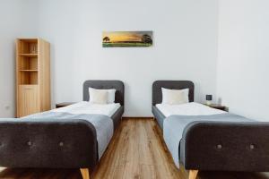 Posteľ alebo postele v izbe v ubytovaní Atticus Apartments