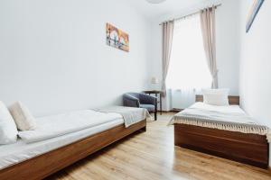 Posteľ alebo postele v izbe v ubytovaní Atticus Apartments