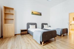 Posteľ alebo postele v izbe v ubytovaní Atticus Apartments