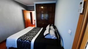 מיטה או מיטות בחדר ב-Casa de Vilarinho