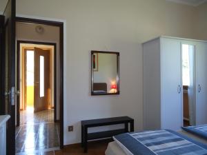 A bed or beds in a room at Villa Soghetta Typ S3