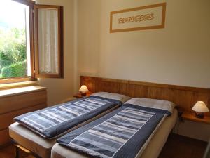 A bed or beds in a room at Villa Soghetta Typ S3 Még 29 kép