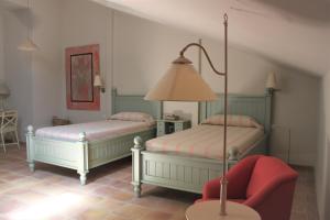 Postel nebo postele na pokoji v ubytování Hotel Boutique Moli El Canyisset