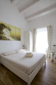 Postel nebo postele na pokoji v ubytování B&B Vivere il Mare