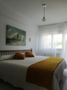 Posteľ alebo postele v izbe v ubytovaní Hostal Pereiriña