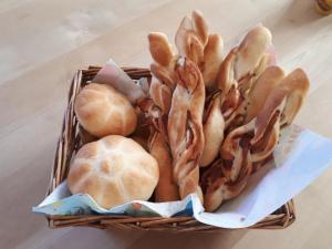 a basket filled with breads and other food items at Untermühlbauer Fam. Schreder in Saalfelden am Steinernen Meer +32 photos