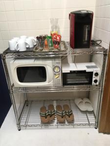A cozinha ou kitchenette de DJANGO Hostel & Lounge