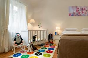 Posteľ alebo postele v izbe v ubytovaní Residence Vocelova