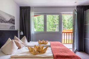 Postel nebo postele na pokoji v ubytování Aparthotel Alpenlodge