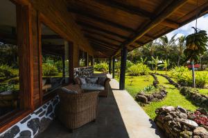 an outdoor patio with furniture on a house at Vaihu Nui Bungalow-Glamping in Hanga Roa