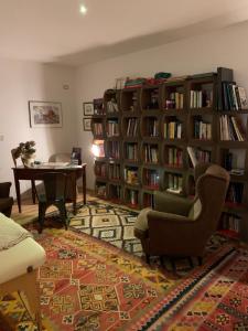 a living room with a library with bookshelves at BIO & B - ITALYKE in Viterbo