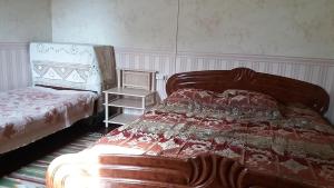 Postel nebo postele na pokoji v ubytování Dacha v Arkadii