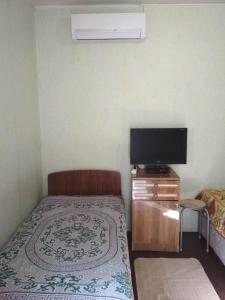 Postel nebo postele na pokoji v ubytování Dacha v Arkadii