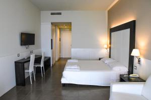Łóżko lub łóżka w pokoju w obiekcie Grand Hotel Balestrieri