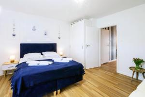 Posteľ alebo postele v izbe v ubytovaní APARTAMENT 4B BLUE MARINE Poddąbie Basen Odkryty Brodziki Plac Zabaw