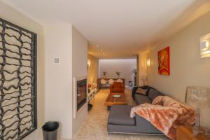 a living room with a couch and a table at Villa Zawaia B&B in Lagos