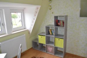 a book shelf in the corner of a room at Am Klostergarten in Heilbad Heiligenstadt