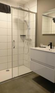 a bathroom with a shower and a sink at B & B De Veurnse Slaper in Veurne +32 photos