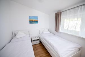 Postel nebo postele na pokoji v ubytování Ferienhaus Prasl
