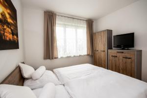Postel nebo postele na pokoji v ubytování Ferienhaus Prasl