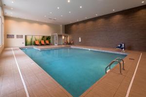 a large swimming pool in a hotel room at EVEN Hotel Omaha Downtown - Old Market, an IHG Hotel in Omaha