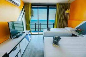 Postel nebo postele na pokoji v ubytování Play Phala Beach Rayong