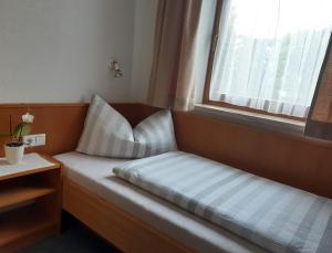 Łóżko lub łóżka w pokoju w obiekcie Appartementhaus St. Martin