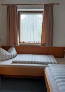 Łóżko lub łóżka w pokoju w obiekcie Appartementhaus St. Martin