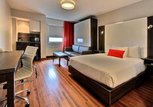 Ένα ή περισσότερα κρεβάτια σε δωμάτιο στο Hotel Classique