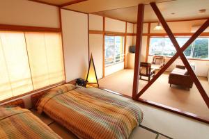 Una cama o camas en una habitación de Beach Commune Simploose (Adult Only)