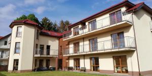 an exterior view of a building with balconies at DW Fantazja in Kołobrzeg