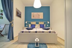 เตียงในห้องที่ Dimora Pascali Holiday - " Rooms & Relax "