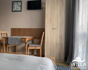 Postel nebo postele na pokoji v ubytování Willa z Tarasami