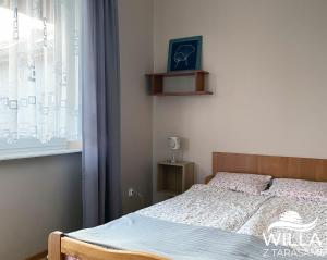 Postel nebo postele na pokoji v ubytování Willa z Tarasami