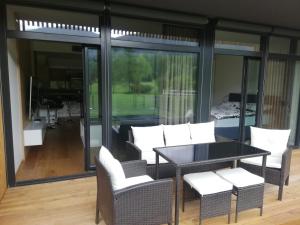 a dining room with a table and chairs at Green apartmány in Čeladná