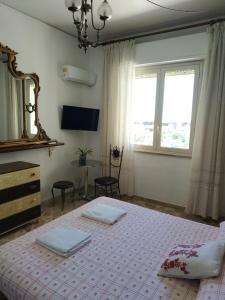 Ένα ή περισσότερα κρεβάτια σε δωμάτιο στο Tilde B&B