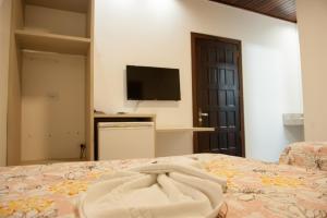 Hotel Pepita Palace tesisinde bir odada yatak veya yataklar