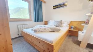 Postel nebo postele na pokoji v ubytování Appartements-Pension Reinstadler