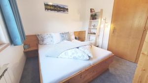 Postel nebo postele na pokoji v ubytování Appartements-Pension Reinstadler